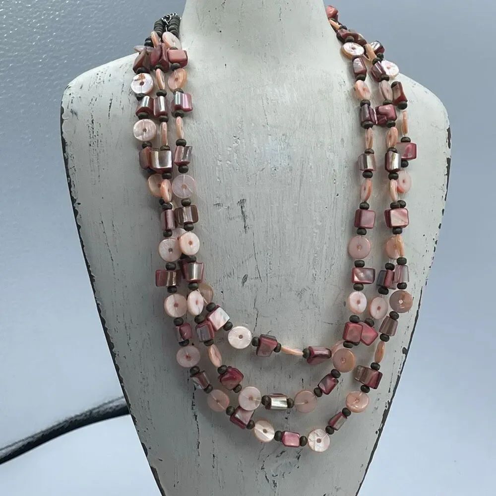 Multi strand genuine mother of pearl shell beads in peach & pink.